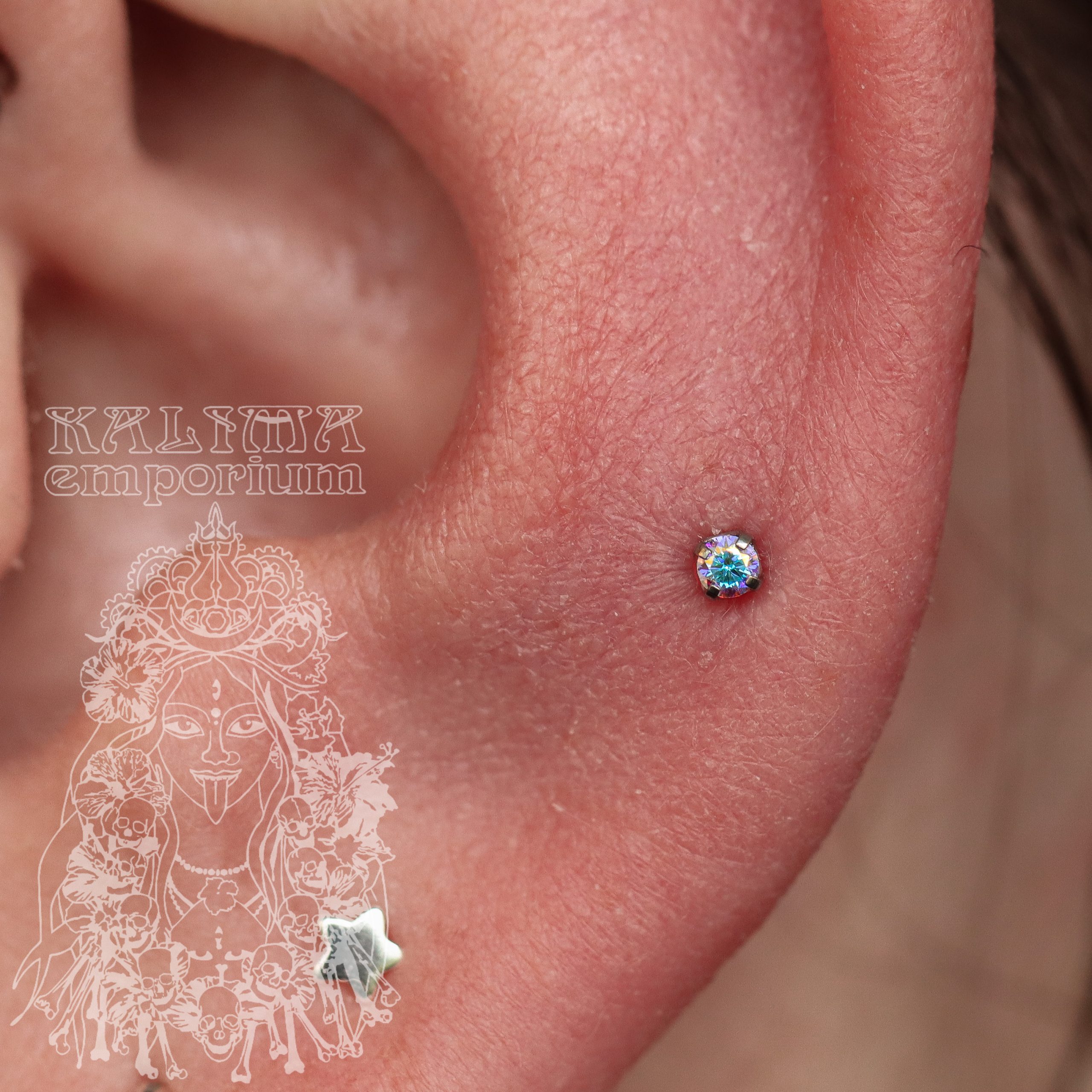 An upgraded mid helix piercing, using a 2mm AB prong set gem from NeoMetal